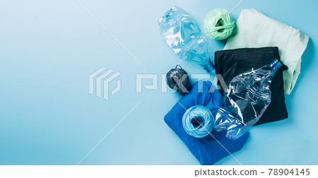 Polyester fiber synthetic fabrics eco-friendly textile recycled recyclable plastic bottles. Reuse recycling used bottles Polyester fiber synthetic fabrics eco-friendly textile recycled recyclable plastic bottles. Reuse recycling used bottles 78904145