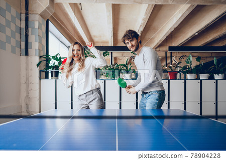 Young people, man and woman playing table tennis 78904228