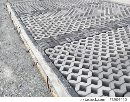 PENANG, MALAYSIA -JUNE 16, 2021: Concrete interlocking pavers and material under construction at the construction site. Used for pedestrian walkway and parking lot.  Advantages in durability and heav 78904430