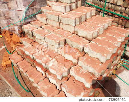 PENANG, MALAYSIA -JUNE 16, 2021: Concrete interlocking pavers and material under construction at the construction site. Used for pedestrian walkway and parking lot.  Advantages in durability and heav 78904431