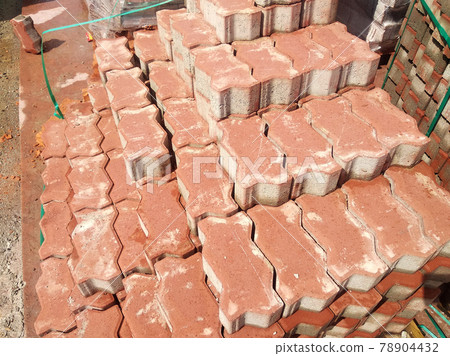 PENANG, MALAYSIA -JUNE 16, 2021: Concrete interlocking pavers and material under construction at the construction site. Used for pedestrian walkway and parking lot.  Advantages in durability and heav 78904432
