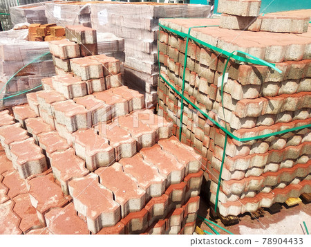 PENANG, MALAYSIA -JUNE 16, 2021: Concrete interlocking pavers and material under construction at the construction site. Used for pedestrian walkway and parking lot.  Advantages in durability and heav 78904433