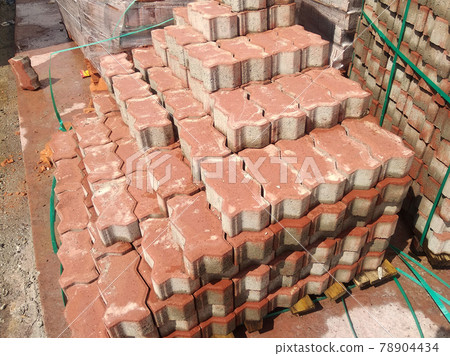 PENANG, MALAYSIA -JUNE 16, 2021: Concrete interlocking pavers and material under construction at the construction site. Used for pedestrian walkway and parking lot.  Advantages in durability and heav 78904434