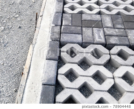 PENANG, MALAYSIA -JUNE 16, 2021: Concrete interlocking pavers and material under construction at the construction site. Used for pedestrian walkway and parking lot. Advantages in durability and heav PENANG, MALAYSIA -JUNE 16, 2021: Concrete interlocking pavers and material under construction at the construction site. Used for pedestrian walkway and parking lot. Advantages in durability and heav 78904448