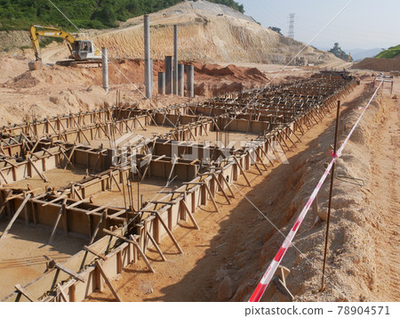 PENANG, MALAYSIA -MARCH 7, 2021: Building ground beam under construction at the site using timber plywood as the formwork. Reinforced by the reinforcement steel to strengthen the structure.  78904571