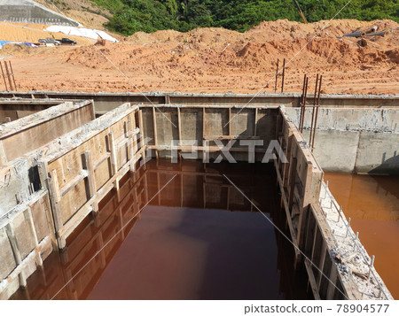 PENANG, MALAYSIA -MARCH 7, 2021: Building ground beam under construction at the site using timber plywood as the formwork. Reinforced by the reinforcement steel to strengthen the structure.  78904577