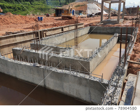 PENANG, MALAYSIA -MARCH 7, 2021: Building ground beam under construction at the site using timber plywood as the formwork. Reinforced by the reinforcement steel to strengthen the structure. PENANG, MALAYSIA -MARCH 7, 2021: Building ground beam under construction at the site using timber plywood as the formwork. Reinforced by the reinforcement steel to strengthen the structure. 78904580