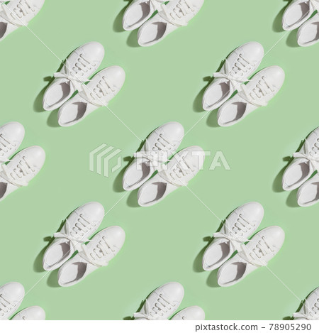 Seamless pattern of white female new gumshoes on green background. Casual outfit. Seamless pattern of white female new gumshoes on green background. Casual outfit. 78905290