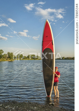 paddler and paddlleboard 78905344