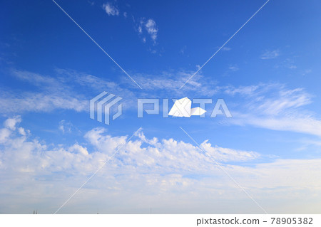 Paper airplane flying in the sky 78905382
