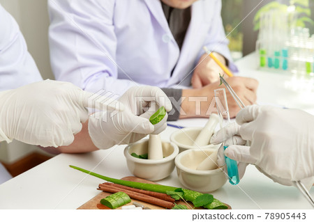 The scientist or doctor make herbal medicine from herb in the laboratory on the table. Herb medicine with herbal the organic natural in the laboratory. 78905443