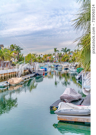 Long Beach California landscape with canal and waterfront homes under cloudy sky Long Beach California landscape with canal and waterfront homes under cloudy sky 78906014