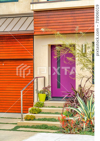 Purple front door and stairs at the facade of home in Long Beach California Purple front door and stairs at the facade of home in Long Beach California 78906019