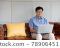 asian senior man using computer laptop at home 78906451