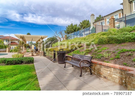 Neighborhood landscape in Huntington Beach California with park and houses 78907187