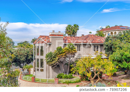 Elegant house in the seaside neighborhood of Huntington Beach against blue sky 78907206