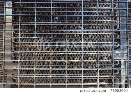 radiator engine construction machine front view metal grid background 78908664