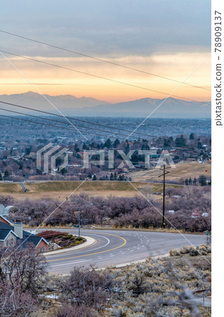 Provo Canyon Utah landscape at sunset with road homes mountain and sky scenery 78909137