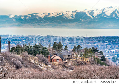 Provo Canyon Utah landscape with lake mountains and trees on a foggy winter day Provo Canyon Utah landscape with lake mountains and trees on a foggy winter day 78909142