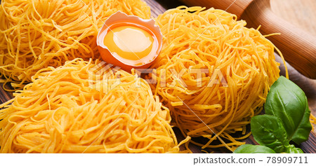 Tagliatelle pasta is thin. Traditional Italian named Angel Hair. Italian egg pasta, homemade and Tagliatelle pasta is thin. Traditional Italian named Angel Hair. Italian egg pasta, homemade and 78909711