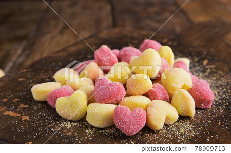 Gnocchi. Traditional Italian pasta with heart-shaped potatoes in different colors. Fresh cooked food Gnocchi. Traditional Italian pasta with heart-shaped potatoes in different colors. Fresh cooked food 78909713