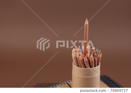 Eco colored pencils made from recycled material. A fence made of wooden pencils. Top view. Free Eco colored pencils made from recycled material. A fence made of wooden pencils. Top view. Free 78909727