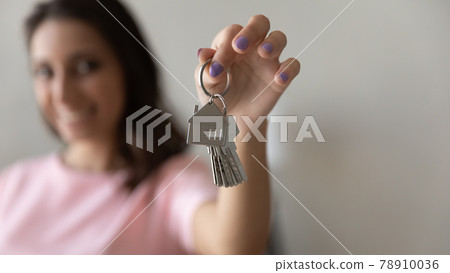 Close up focus on keys in happy Arabian woman hand Close up focus on keys in happy Arabian woman hand 78910036