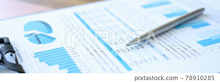 Clipboard with financial report and pen lie on table Clipboard with financial report and pen lie on table 78910285