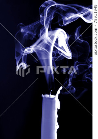 the smoke of an extinguished candle on black background the smoke of an extinguished candle on black background 78911949