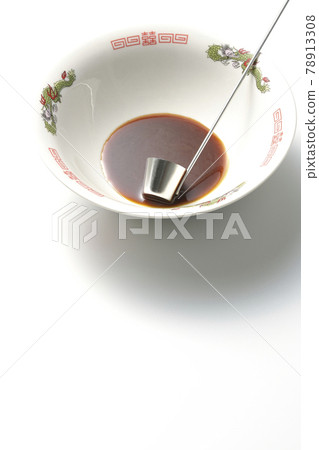 A white background shot of the ramen bowl with the original soy sauce ramen and ladle 78913308