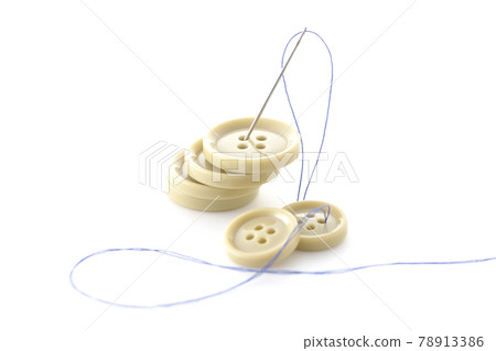 Shoot buttons, needles and threads on a white background 78913386