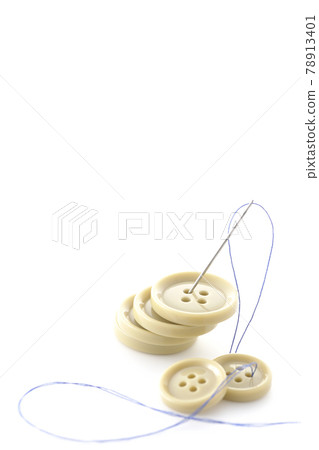Shoot buttons, needles and threads on a white background 78913401