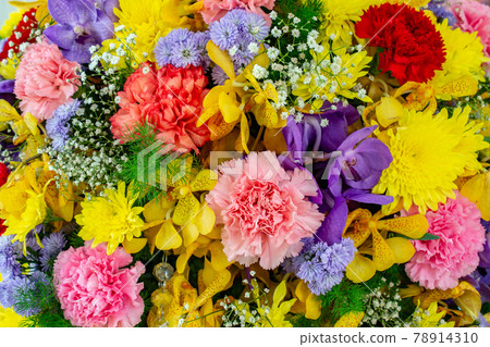 Abstract background with bunches of different varieties of colourful flowers. Flowers have long been admired and used by humans to bring beauty to their environment. 78914310