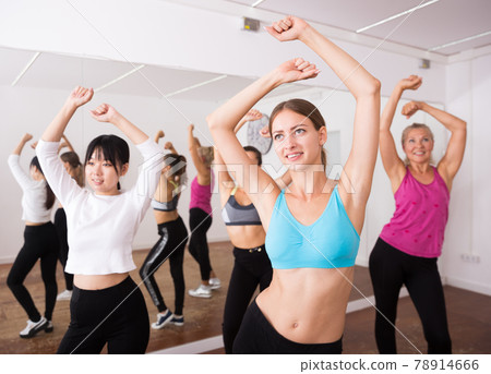 Fitness women practicing zumba movements 78914666