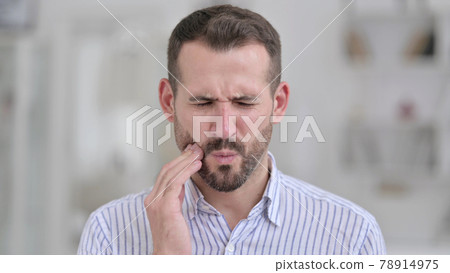 Portrait of Sick Young Man having Toothache  78914975