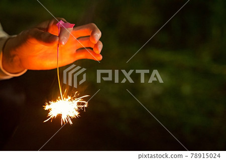 Sparkler held in hand [Summer image] 78915024
