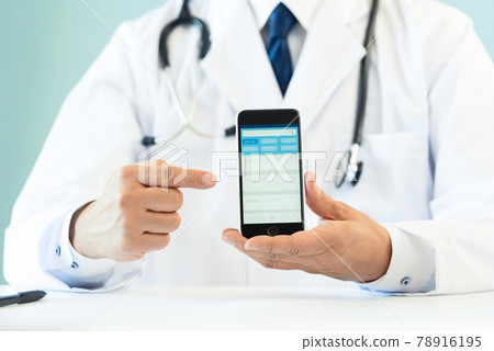 Hands of a doctor showing a smartphone app Hands of a doctor showing a smartphone app 78916195