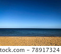 Sand beach, sea water waves and beautiful blue sky at Brighton beach in Melbourne, Australia. 78917324