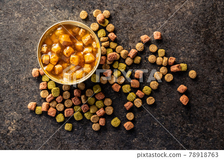 Canned pet food and dried kibble. Tasty food for dog or cat. Canned pet food and dried kibble. Tasty food for dog or cat. 78918763