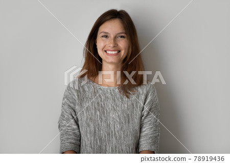 Head shot portrait of smiling beautiful woman on grey background 78919436