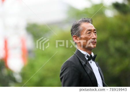 A businessman, a man in a black tie, a Japanese A businessman, a man in a black tie, a Japanese 78919943