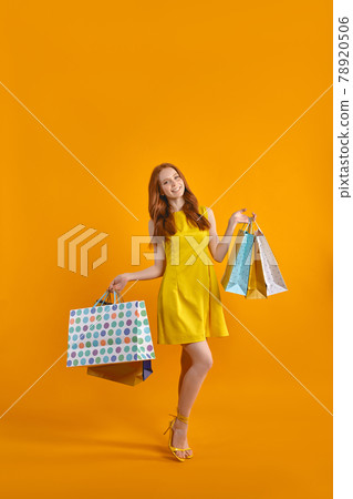 Full length portrait of excited model lady carry many packs enjoying sales shopping 78920506