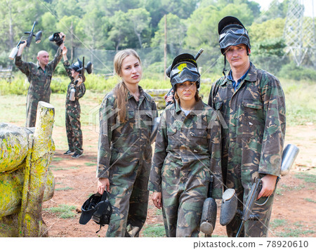 Portrait of upset team of paintball players in full equipment lost game in forest Portrait of upset team of paintball players in full equipment lost game in forest 78920610