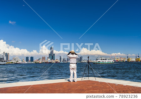 Tourists visiting the scenery and take photos in the port of Kaohsiung, Taiwan. Tourists visiting the scenery and take photos in the port of Kaohsiung, Taiwan. 78923236
