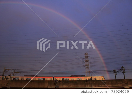 Tsukuba Express TX-2000 series, a train that goes over the rainbow and the elevated train at dusk 78924039