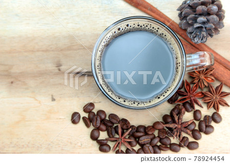 cup of coffie with cinnamon and star anise on wooden background cup of coffie with cinnamon and star anise on wooden background 78924454