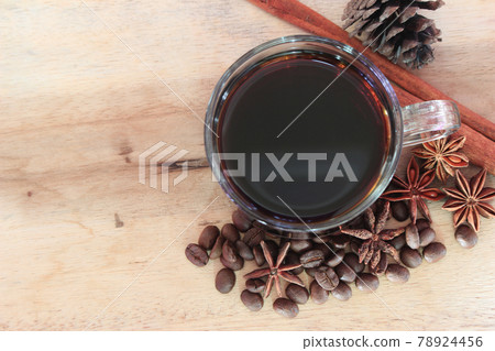cup of coffie with cinnamon and star anise on wooden background cup of coffie with cinnamon and star anise on wooden background 78924456