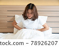 Woman having painful stomachache 78926207