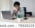 Young businessman in eyewear  working at home 78926228