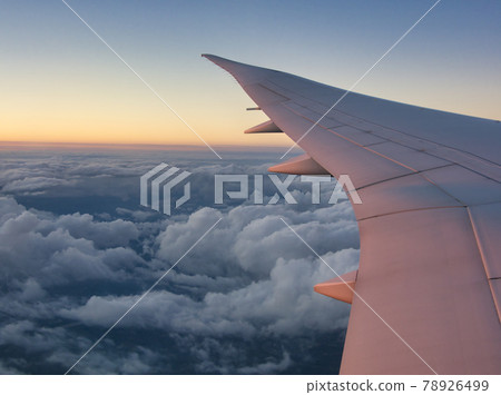 Beautiful sunset clouds and sky from the window of an airplane Beautiful sunset clouds and sky from the window of an airplane 78926499